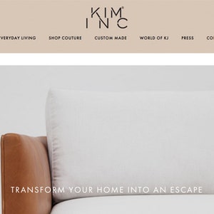 May include: A white leather sofa with a brown leather armrest. The sofa is in front of a white wall. The text "TRANSFORM YOUR HOME INTO AN ESCAPE" is displayed below the sofa.