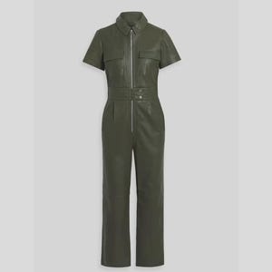 May include: Olive green short-sleeve jumpsuit with a collared neckline and a silver zipper. The jumpsuit features two chest pockets, a fitted waist, and straight-leg pants. The garment is made of a smooth, leather-like material.
