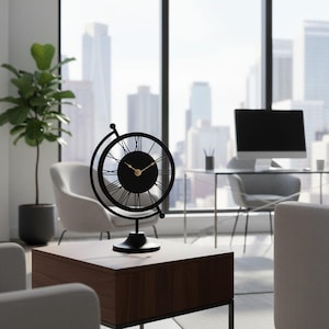 A black and gold desk clock with a globe design. The clock features Roman numerals and gold hands. The clock is on a dark brown wooden table in an office setting. The clock measures approximately 10 inches in height.
