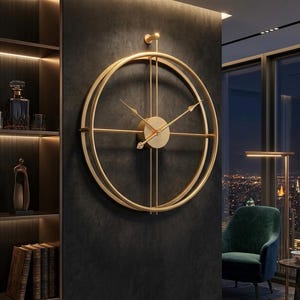 May include: A large, gold-colored, circular wall clock with a minimalist design. The clock features two concentric rings and slender hands. It is mounted on a dark gray wall, with a glimpse of a bookshelf and a city view in the background.