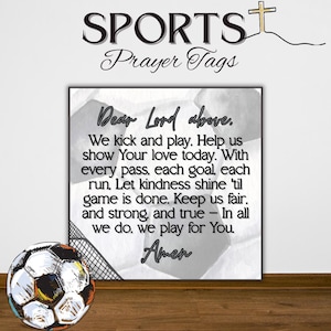 May include: A framed print with the text "Dear Lord above...Amen" and the words "SPORTS Prayer Tags" at the top. A soccer ball is in the foreground. The print has a soccer ball design in the background.