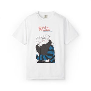 May include: White t-shirt featuring a graphic of two people embracing. The illustration depicts a person in a black jacket and a person in a blue and black striped sweater. The shirt has text in Korean and the English phrase "A Business Proposal".