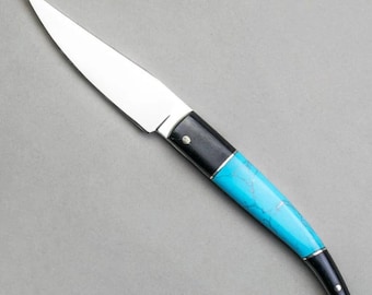 Handgjord fällkniv med läderslida