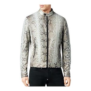May include: A light-coloured jacket with a snakeskin pattern. The jacket has a stand-up collar, a front zip, and two side pockets. The sleeves are long, and the jacket is worn over black trousers.