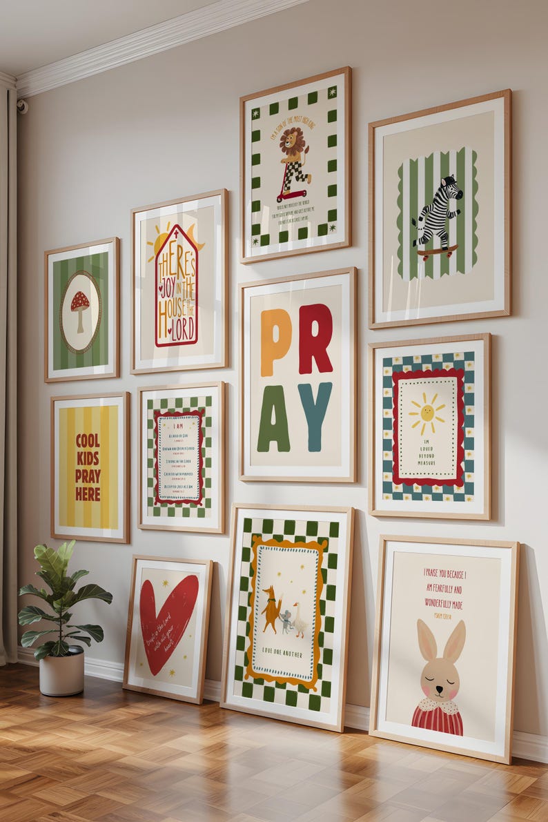 May include: A collection of framed art prints with various illustrations and text. The prints feature images of a mushroom, a lion on a scooter, a zebra on a skateboard, and the word "PRAY". Other prints include inspirational quotes and a heart.