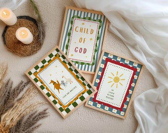 Könnte beinhalten: Drei gerahmte Kunstdrucke mit Holzrahmen. Einer zeigt "CHILD OF GOD" in Rot und Gold. Ein anderer zeigt ein Pferd, eine Gans und einen Engel mit dem Text "LOVE ONE ANOTHER". Der dritte zeigt eine Sonne und den Text "I'M LOVED BEYOND MEASURE".