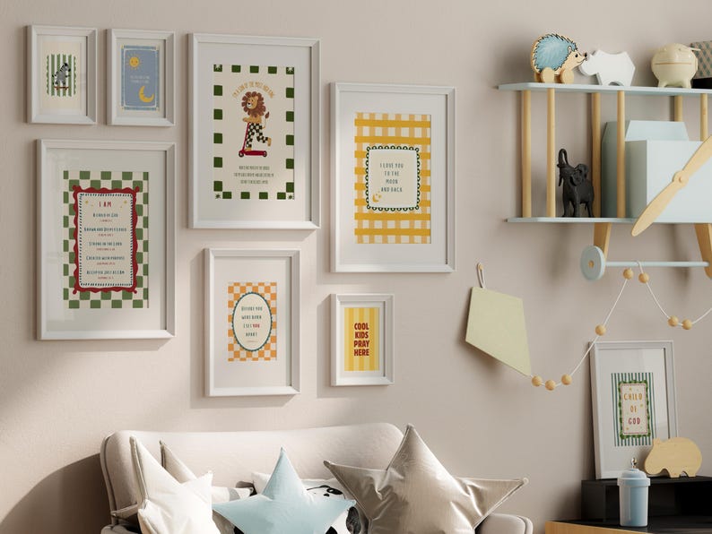 May include: A collection of framed art prints with white frames, featuring various designs and text. The prints include a lion on a scooter, a checkered pattern, and inspirational quotes. The color palette includes green, red, yellow, and blue.