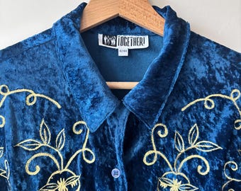 May include: A deep blue crushed velvet button-down shirt featuring gold embroidered floral patterns on the front. The interior label reads TOGETHER! with the size 42/44. The shirt has a classic collar and a single visible blue button.