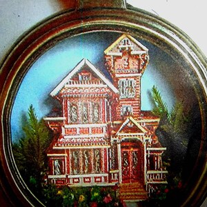 Dollhouse miniature collectible art of a 3D Victorian mansion in a pocket watch from Ginger Langdon Siegel