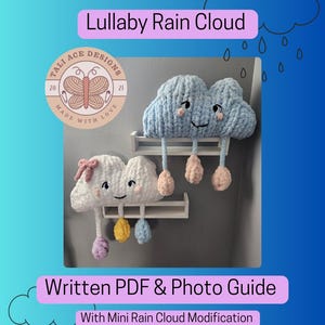 May include: Two handmade crochet cloud decorations with smiling faces and dangling rain drops. One cloud is light blue, the other is white. The text "Lullaby Rain Cloud" and "Written PDF & Photo Guide" are displayed.