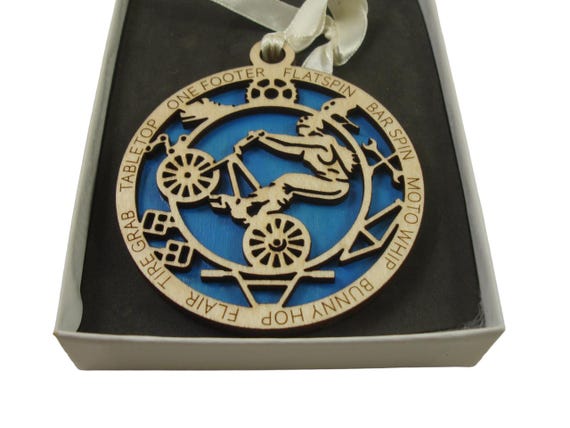 Girl BMX Bike Rider Ornament Laser Engraved From Birch Wood
