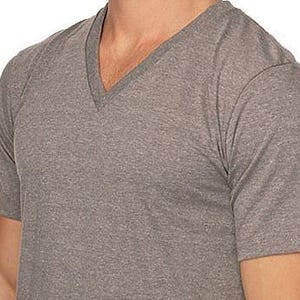 May include: A heather gray V-neck t-shirt. The short-sleeved shirt is made of a soft material. The shirt is a solid color and has a classic, simple design.