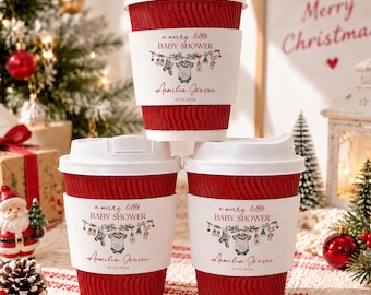 May include: Three red, ribbed disposable coffee cups with white lids and white sleeves. The sleeves feature the text 'a merry little BABY SHOWER', 'Aemilia Jonson', and '10/15/2028', along with a graphic of baby clothes hanging on a string.