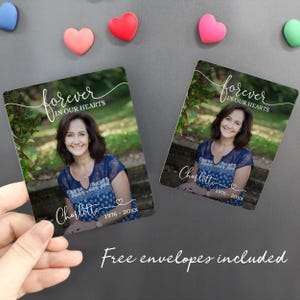 May include: Two rectangular memorial magnets featuring a photo of a woman with the text "forever in our hearts" and the name "Charlotte" with birth and death years. The phrase "Free envelopes included" is written below.