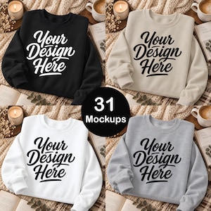 May include: A collection of four crewneck sweatshirts in black, beige, white, and grey, each featuring the text Your Design Here in a bold script font. The sweatshirts are displayed in a grid layout, showcasing the variety of available colours.