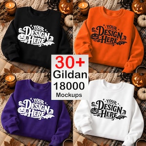 May include: A collection of four crewneck sweatshirts in black, orange, purple, and white, each featuring a white graphic print of a jack-o'-lantern, bat wings, and the text "YOUR DESIGN HERE". A central white sign displays "30+ Gildan 18000 Mockups".