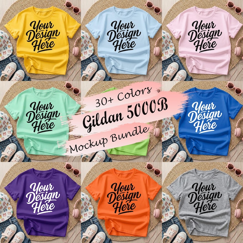 May include: A collection of short-sleeved t-shirts in yellow, light blue, pink, mint green, bright blue, purple, orange, and gray, each featuring the black text Your Design Here. A central graphic displays 30+ Colors Gildan 5000B Mockup Bundle.