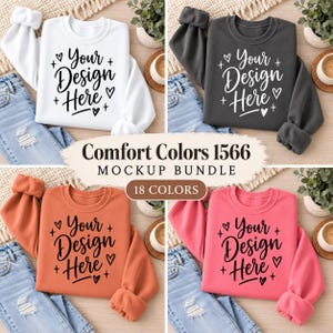 Könnte beinhalten: Ein Bündel aus vier Rundhals-Sweatshirts in Weiß, Dunkelgrau, Orange und Pink, die jeweils den schwarzen oder weißen Schriftzug Your Design Here umgeben von Herz- und Sternsymbolen zeigen. Der Text Comfort Colors 1566 MOCKUP BUNDLE 18 COLORS ist zentriert.