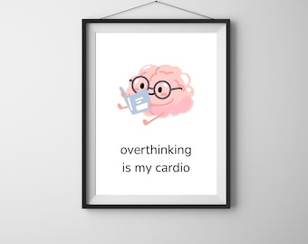 May include: Framed art print featuring a cartoon brain wearing glasses and reading a book. The brain is pink, and the book is blue. The text "overthinking is my cardio" is below the brain.