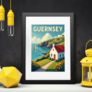 May include: Framed art print featuring a coastal scene with the word "GUERNSEY" at the top. The artwork depicts a white cottage with a red roof, a sailboat on the water, and a path leading to the house. The print is in a black frame.