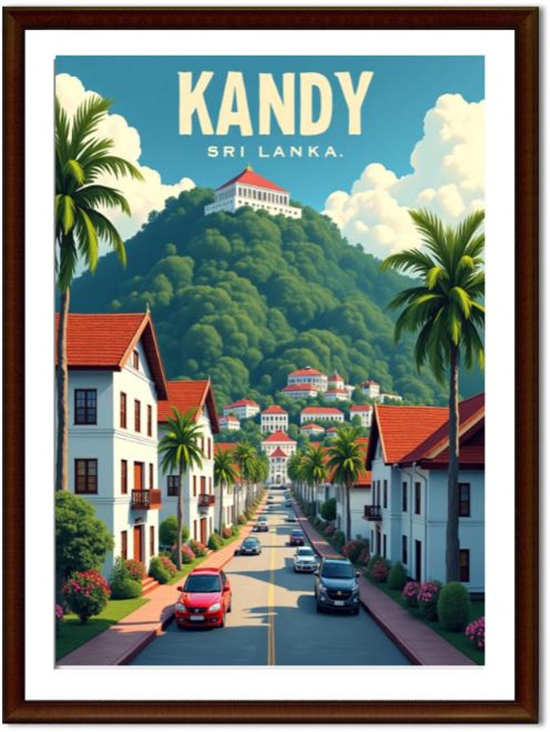 May include: A framed travel poster for Kandy, Sri Lanka. The image features a street lined with white buildings with red tile roofs, palm trees, and cars. The background shows a lush green mountain with a white building on top, under a blue sky with clouds.