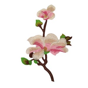 May include: Embroidered floral patch featuring a magnolia flower with pink and cream petals, green leaves, and a brown stem. The patch is designed for decorative purposes, suitable for clothing or accessories.