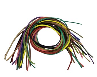 May include: A collection of colorful shoelaces in various shades, including green, yellow, red, and brown. The laces are arranged in a circular pattern, with the ends extending outwards. The image is set against a plain white background.