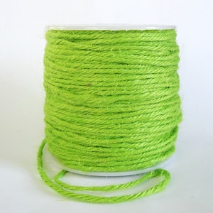 May include: A spool of bright green twine, perfect for crafting and DIY projects.