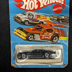 Hot Wheels Hot Bird / 1979 NOS / On Card / Mattel / Negro con Fénix Amarillo / Clásico / Hong Kong / Coche coleccionable