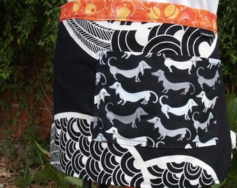 Woman's half apron in black and white, heavy canvas, Dachshound dogs pocket, orange and yellow long ties