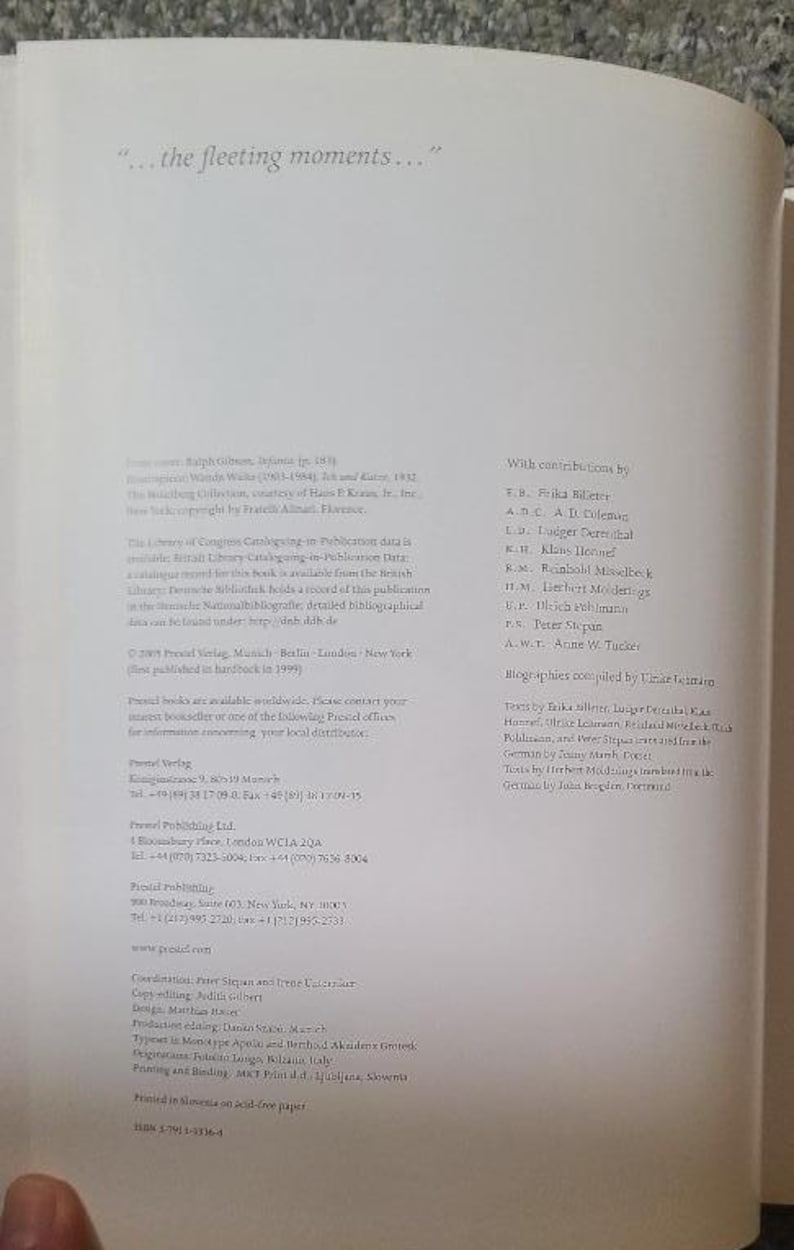 May include: A book page with text, featuring the quote "...the fleeting moments..." at the top. The page includes details about the book's contributors, publishing information, and ISBN. The text is in a serif font.
