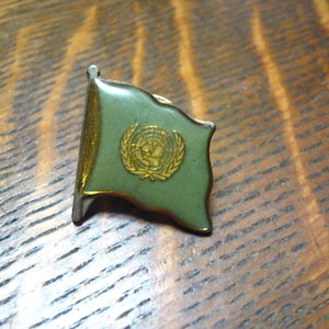 KACO-reversspeld met vlag van de Verenigde Naties uit de jaren 80