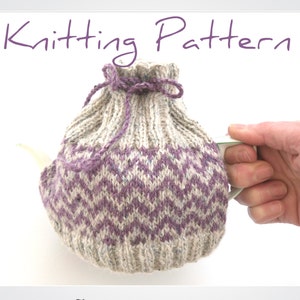 May include: A knitted tea cosy with a chevron pattern in purple and white, featuring a drawstring closure and a purple tie. The text "Knitting Pattern" is visible. The cosy is shown on a teapot, held by a hand.