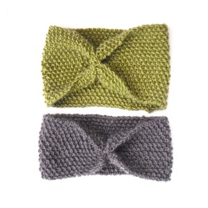 May include: Two knitted headbands. One is olive green, the other is gray. Both headbands have a twisted knot design in the center. The headbands are made of a thick, textured yarn and are displayed on a white background.