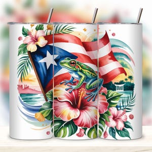 May include: White tumbler featuring a vibrant design with the Puerto Rican flag, a green frog, and hibiscus flowers. The design includes tropical foliage and a scenic background. Includes a silver straw.