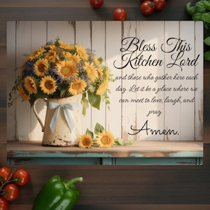 May include: A rustic kitchen sign with the text "Bless This Kitchen Lord" and a bouquet of sunflowers in a vintage pitcher. The sign has a wooden background and a blue and white gingham bow.