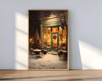 May include: A framed painting depicts a cozy cafe scene at night during winter. The cafe has a green door and trim, with a Christmas wreath. A decorated Christmas tree stands outside, and snow covers the ground. Tables and chairs are set up for outdoor seating.