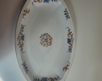 This is a Heinrich & Co. Selb Bavaria large oval serving platter featuring a colorful floral pattern and a gold-trimmed rim.
