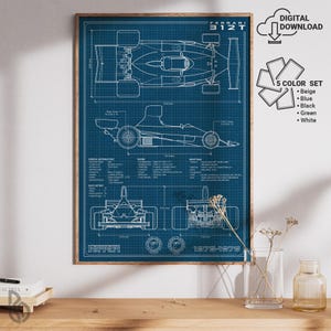 May include: A framed blueprint of a Ferrari 312T race car, showing top, side, and front views, with technical details. The print is on a blue grid, with the text "FERRARI 312T 1975-1976". Includes a "DIGITAL DOWNLOAD" and "5 COLOR SET" options.