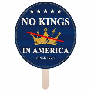 May include: A round, blue and gold hand fan with the text "NO KINGS IN AMERICA SINCE 1776". The fan features a gold crown crossed out with a red line, and five white stars at the top. The handle is made of light-colored wood.