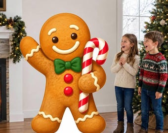 May include: A large gingerbread man cutout featuring a smiling face, a green bowtie, two red buttons, and white icing trim on the arms and legs. The figure holds a red and white striped candy cane in one hand and waves with the other.