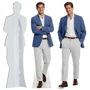May include: A cardboard cutout of a person in a blue blazer, white shirt, and gray pants stands next to two people wearing the same outfit. The people are wearing brown leather shoes and brown belts. The background is white.