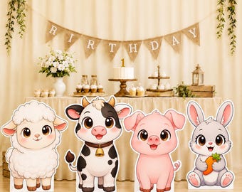 May include: Four freestanding cardboard cutouts featuring cartoon animals: a white fluffy sheep, a black and white cow with a bell collar, a pink pig, and a grey rabbit holding an orange carrot, all arranged in a row on a light wooden floor.