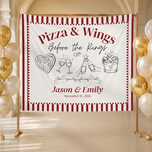 May include: A white rectangular fabric banner with a red and white striped border. The text reads Pizza & Wings Before the Rings, Jason & Emily, and November 11, 2026. Illustrations include a heart-shaped pizza, wine glasses, beer bottles, and wings.
