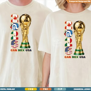 May include: Off-white t-shirts with a graphic featuring the text "2026" in the colors of Canada, a soccer ball, Mexico, and the USA, next to a golden trophy. The text "CAN MEX USA" is below the numbers.