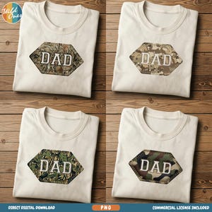 May include: Four cream-coloured t-shirts, each featuring a camouflage hexagon patch with the word "DAD" in white block letters. The camouflage patterns differ slightly across the shirts. The t-shirts are neatly folded on a wooden surface.