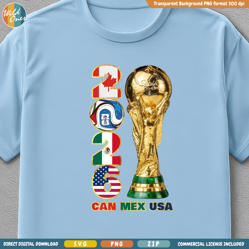May include: Light blue t-shirt featuring a gold trophy and the text "2026" with flags of Canada, Mexico, and the USA. The text "CAN MEX USA" is below the numbers. The shirt has a crew neck.
