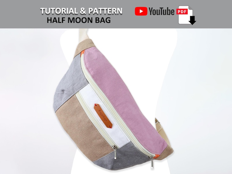 May include: A half moon bag made of fabric in shades of gray, beige, white, and pink. The bag has a zipper closure and a small leather label with the word "Baguette" on it.