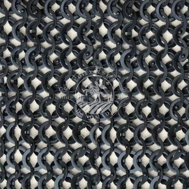 May include: Close-up of a section of chainmail armour. The interlocking metal rings are dark grey, creating a textured pattern. The background is a light, off-white colour. A circular logo with text and a knight on a horse is visible.