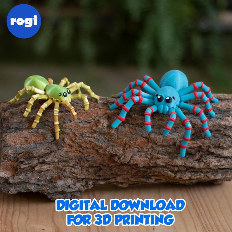 May include: Two colorful 3D-printed spiders rest on a piece of wood. One is green and yellow, the other is blue with red accents. The image includes the text "DIGITAL DOWNLOAD FOR 3D PRINTING" and the logo "rogi".